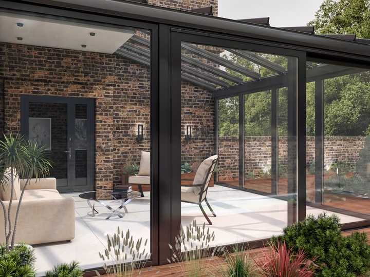 Wintergarten aus Aluminium von Drutex mit Sitzbereich