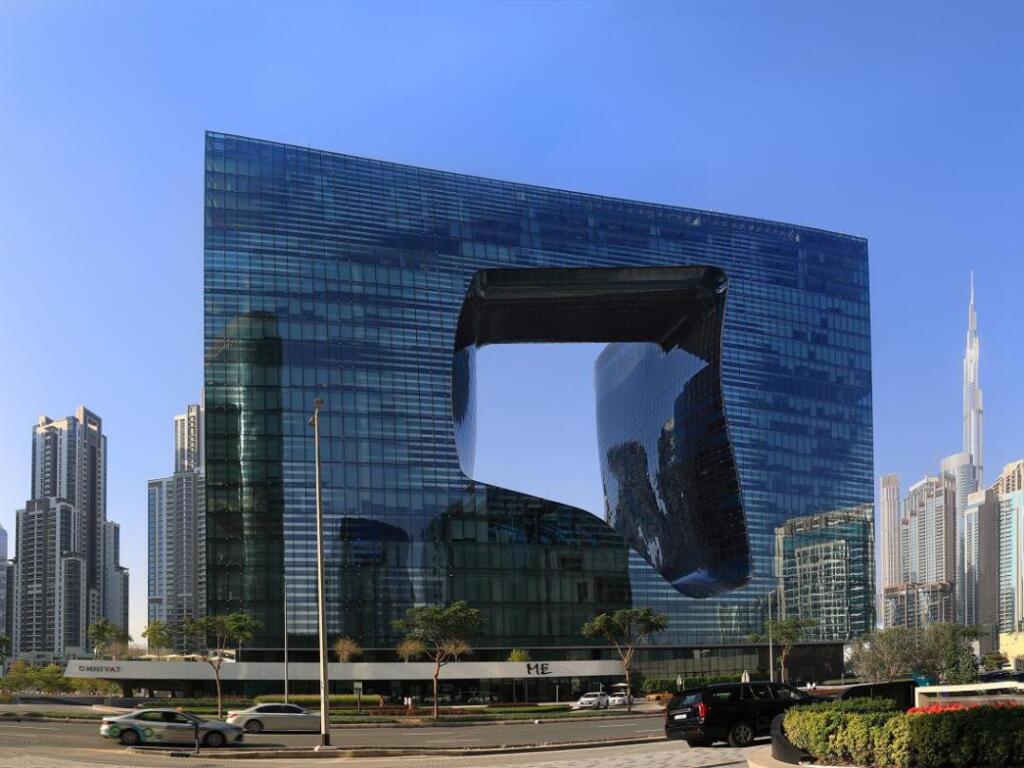 Dubai, UEA - February 25. 2023: The futuristic architectur of the Opus building at Omniyat is a work of Dame Zaha Hadid with an organic void right in the middle of the building. Copyright (c) 2023 YueStock/Shutterstock.
